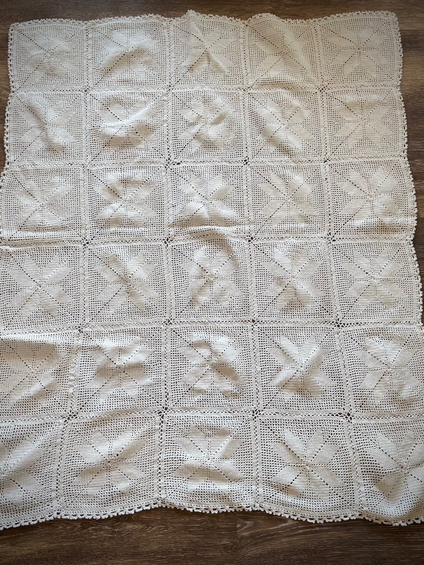 A vintage crochet altar cloth laid out flat, primarily in off-white color with a geometric pattern.